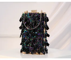 Detailed shot of the vintage beaded evening clutch bag, showing exquisite handmade sequin texture.
