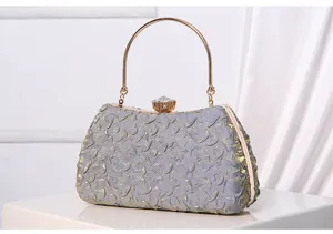 Elegant grey evening clutch with gold metal handle and crystal clasp for parties.