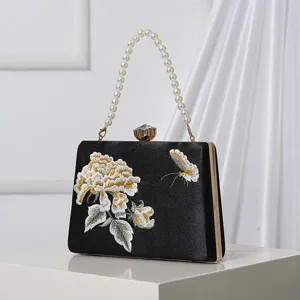 Elegant black satin evening clutch bag with pearl handle and embroidered peony flower.