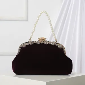 Vintage velvet evening clutch bag with elegant pearl handle and rhinestone clasp for party