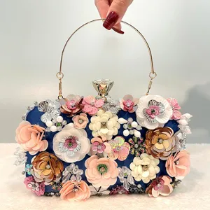Handmade floral evening clutch bag with metal handle, elegant beaded purse for women.
