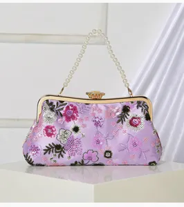 Purple floral sequin evening bag with elegant pearl handle and metal clasp closure