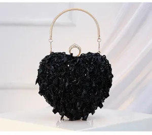 Detailed close-up showing the sparkling black beaded texture and elegant metal handle design.