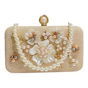 Elegant gold pearl evening clutch bag for women, chic beaded banquet handbag with flowers.
