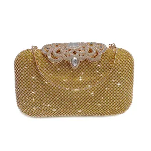 Elegant gold rhinestone evening clutch bag with sparkling crystals and metal handle.
