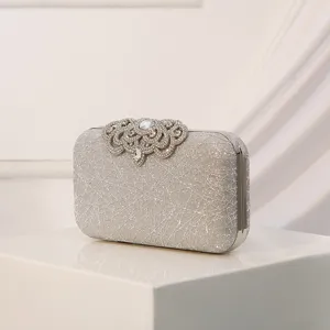 Bolso de noche con purpurina plateada y cierre de cristal elegante bolso de mano.