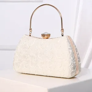 Elegant women evening clutch bag with metal gold handle and crystal clasp for party dress.