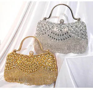 Luxury rhinestone evening clutch bag with metal handle and stunning fringe design for party.