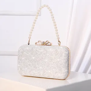 Elegant pearl strap evening clutch bag with sparkling lace finish and bow clasp for women parties.