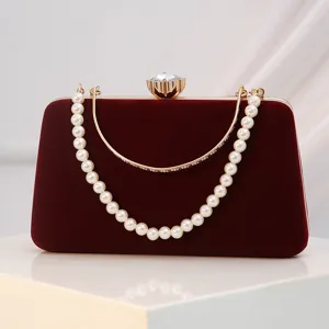 Burgundy velvet evening clutch bag with pearl handle and crystal clasp for women parties.