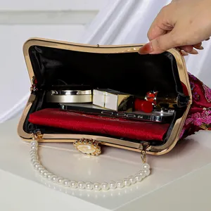 Elegant sequin floral evening clutch bag with pearl handle and metal frame for women parties.