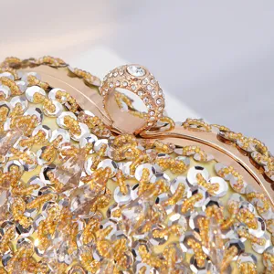 Stunning heart-shaped evening clutch bag with sparkling sequins, beads, and rhinestone ring clasp.
