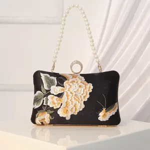 Vintage silk embroidered evening clutch bag for women, elegant pearl handle qipao handbag.