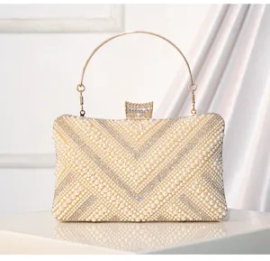 Elegant handmade pearl rhinestone evening clutch bag with golden metal handle for banquet parties.