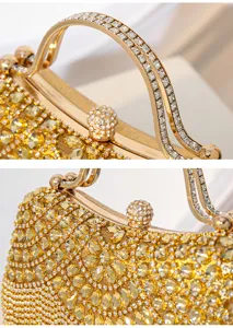 Gold rhinestone evening bag detail shot showcasing exquisite crystal embellishment and metal handle.