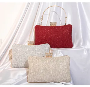 Detailed view of elegant evening clutches featuring lace, sequins, and crystal clasps.