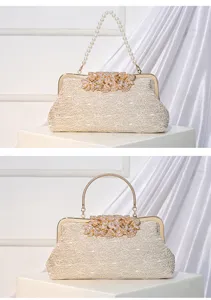 Elegant vintage lace evening handbag with rhinestone flower and pearl handle for party.