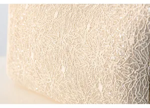 Exquisite beige lace and sequin fabric detail for elegant evening party handbags and purses.