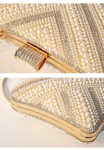 Handmade pearl rhinestone evening clutch detail showing exquisite beaded texture and gold frame.