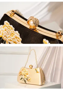 Detailed view of Chinese style embroidered evening clutch with pearl handle and rhinestone clasp.