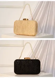 Élégant sac de soirée en dentelle et sequins avec poignée perle, idéal pour les fêtes.