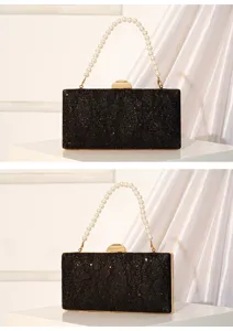 Elegant black sequin evening clutch bag with pearl handle and gold clasp for women.