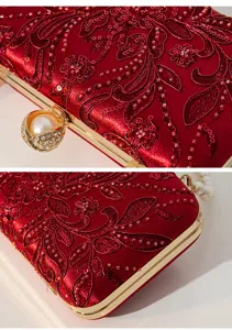 Exquisite red bead-embroidered evening bag with gold frame and pearl clasp detail.