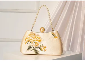 Exquisite Chinese style embroidered evening clutch bag with elegant pearl handle and floral design.