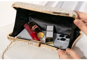 Details of elegant lace sequin evening clutch bag with metal chain and large capacity interior.