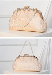 Elegant lace evening clutch bag with pearl handle and rhinestone clasp, perfect for weddings.