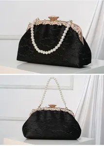 Black lace evening clutch bag with pearl chain handle and sparkling rhinestone clasp details.