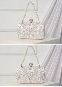 White beaded evening clutch bag detail, exquisite sequin embroidery and elegant pearl handle.