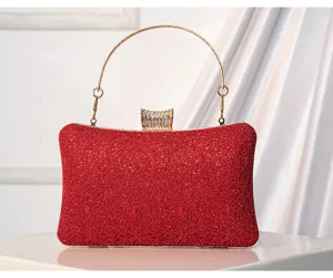 Elegant red lace evening clutch bag with gold metal handle and sparkling rhinestone clasp.