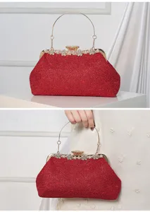 Detailed view of red lace evening clutch bag with metal handle for wedding party dress.