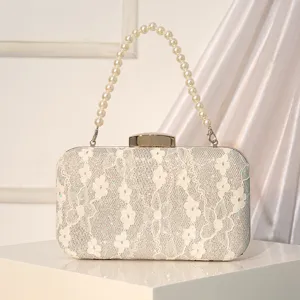 Sac de soirée élégant en dentelle et sequins avec poignée en perles pour robe de fête.