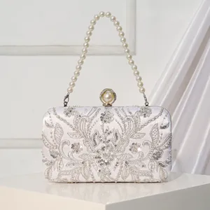 Elegant white bead-embroidered evening clutch bag with pearl handle for bridal wedding party.