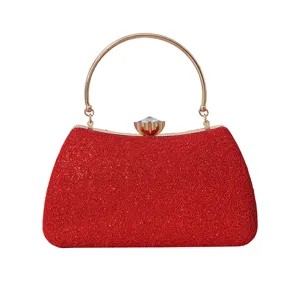 Elegant red evening clutch bag with gold metal round handle and crystal clasp for women.
