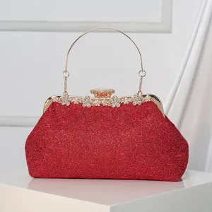 Red lace evening clutch bag for women, elegant bridal handbag with rhinestones and metal handle.