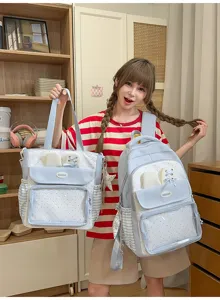 Detail view of the light blue polka dot backpack and matching tote bag set, cute aesthetic.