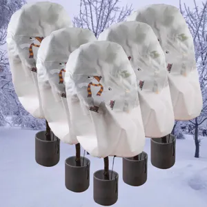 Detailed view of plant frost protection cover with cute polar bear print and winter design.
