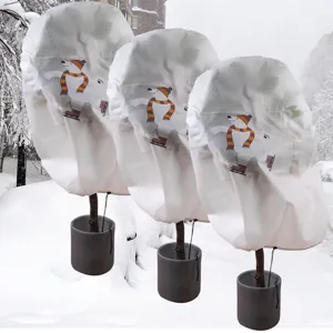 Winter plant cover frost protection non-woven plant jacket with cute polar bear print pots.