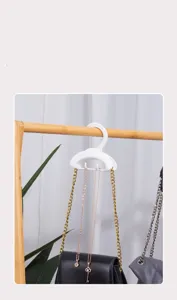 Multifunctional arch bag hook for wardrobe, versatile rack for belts, scarves, and purses.