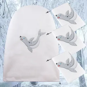 Details van de witte plantenbeschermhoes met schattig zeehondenpatroon en koord.