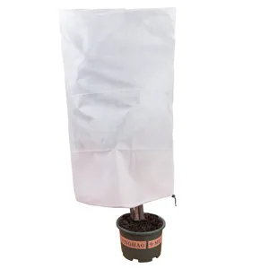 Detailed view of plant frost protection cover fabric, showing soft breathable texture for winter.