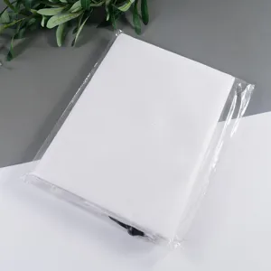 Detail view of white winter plant frost protection cover, breathable garden shrub shield.