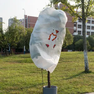 Winter plant frost protection cover, non-woven fabric cold weather plant protector with polar bear.