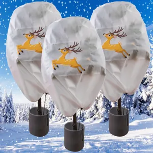 Detailed view of white plant frost protection covers featuring a cute reindeer print for winter.