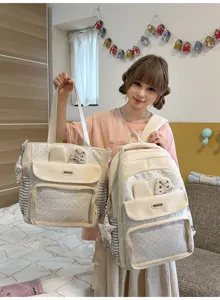 Cute polka dot backpack and tote bag set with bunny ears and clear pocket detail close-up.