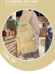 Detailed view of casual yellow striped backpack, large capacity school bag for students.