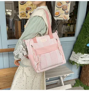 Korean style pink striped canvas shoulder bag for women, large capacity daily backpack.